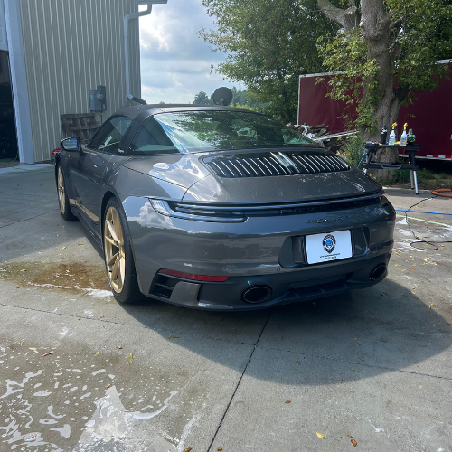 Rear view of a grey Porsche 911 after an exterior detail