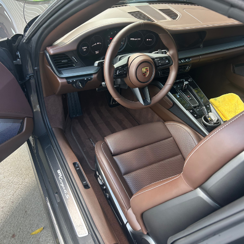 Porsche 911 brown leather interior after a full interior detail